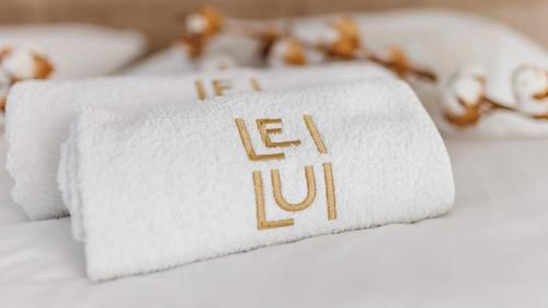 a close up of a white towel with the word letuce at Casa Lei by Villas Holiday in Malinska