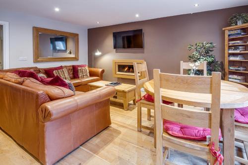 a living room with a couch and a table at The Jewellery Suites Birmingham in Birmingham