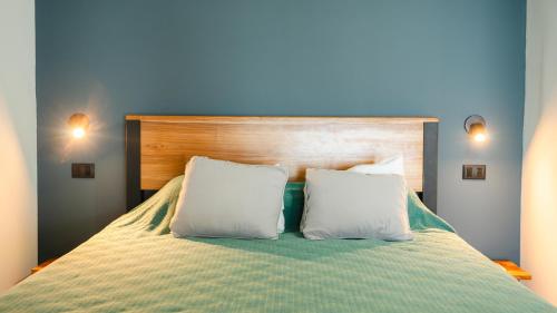 Una cama o camas en una habitación de Hotel Buenos Aires