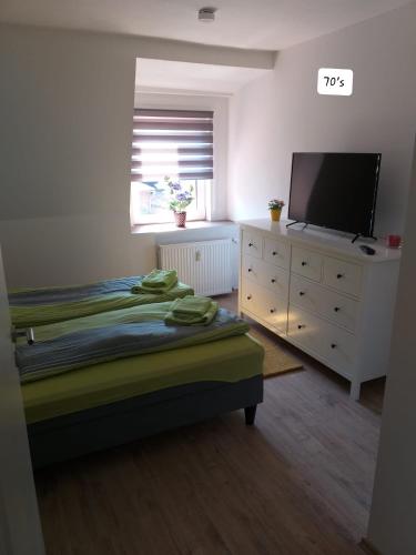 Postel nebo postele na pokoji v ubytování Fewo's Ahrend