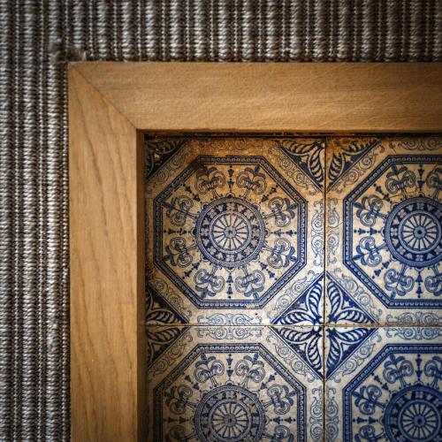a blue and white tile pattern on a wall at The Assembly House in central Norwich in Norwich