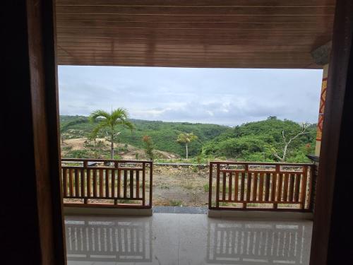 a view from a door of a room with a window at Kelingking BMS Penida Hills Villa in Nusa Penida