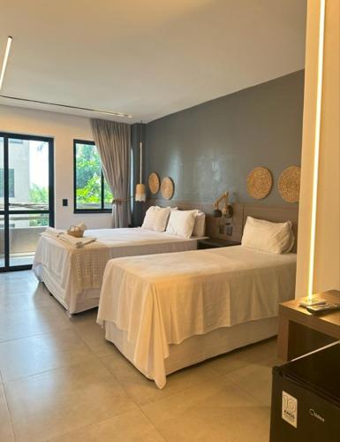 Ένα ή περισσότερα κρεβάτια σε δωμάτιο στο Maly Boutique Hotel