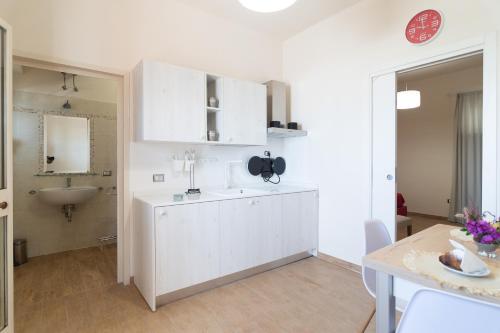 Kuchyň nebo kuchyňský kout v ubytování Hotel Maremma Sul Mare