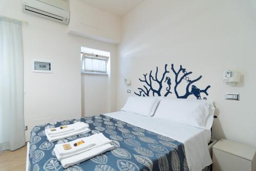 Postel nebo postele na pokoji v ubytování Hotel Maremma Sul Mare