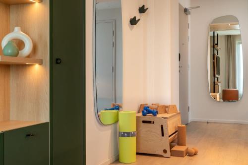 a room with a mirror and some boxes in a room at Element by Westin Wroclaw in Wrocław