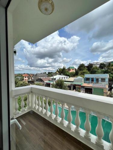 a balcony with a view of a city at Hodota Ankroet Hotel & Spa in Da Thanh