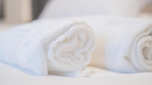 a roll of white toilet paper on a table at Modern Room in Olbia