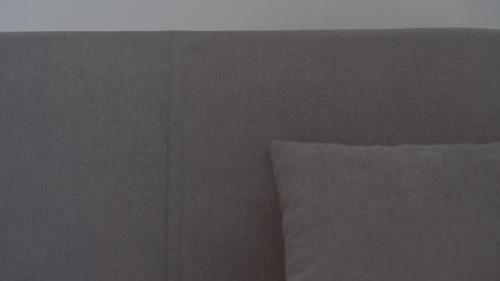 a close up of a bed with a pillow at Modern Room in Olbia