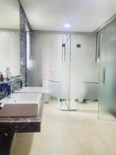 a bathroom with a tub and a shower and a sink at Tanamera Estate Weligama in Weligama