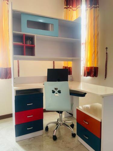 an office with a desk with a computer and a chair at Tanamera Estate Weligama in Weligama
