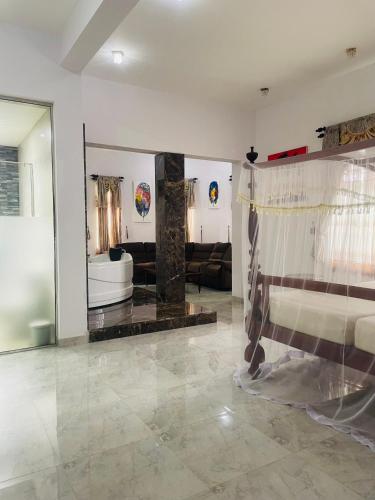 a living room with a couch and a table at Tanamera Estate Weligama in Weligama