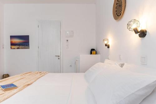 Ένα ή περισσότερα κρεβάτια σε δωμάτιο στο NAXOS BEACHWALK
