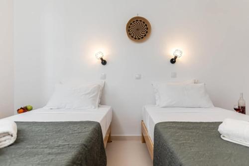 Ένα ή περισσότερα κρεβάτια σε δωμάτιο στο NAXOS BEACHWALK