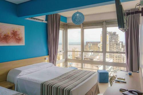 Katil atau katil-katil dalam bilik di Hotel Dan Inn Express Porto Alegre by Nacional Inn - Próximo ao Complexo Hospitalar Santa Casa e UFRGS