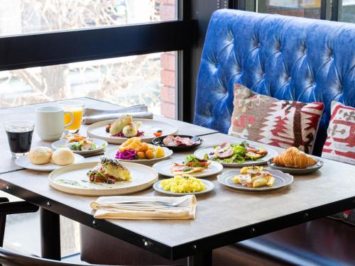 a table full of plates of food on a table at Mitsui Garden Hotel Sapporo West in Sapporo