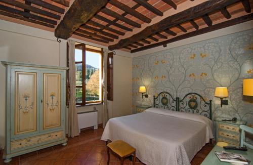 Ένα ή περισσότερα κρεβάτια σε δωμάτιο στο Hotel Villa Cheli