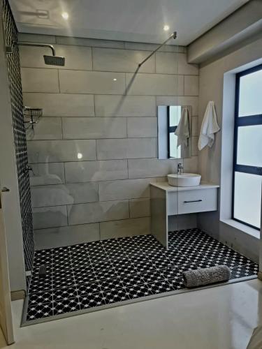 a bathroom with a shower and a sink at Montagu Villa 3 in Mossel Bay