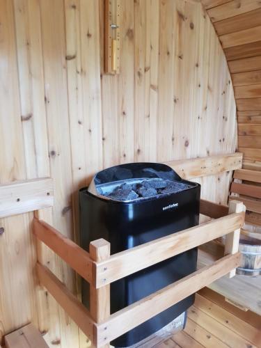 a inside of a sauna with a stove at Althéa, gîte de charme et bien être in Fontenay-le-Comte