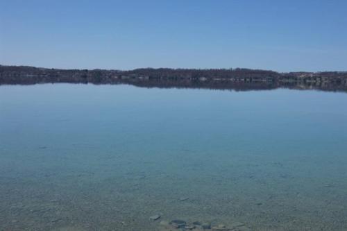 a view of a large body of water at Lakeside Cottage on Torch Lake in Alden