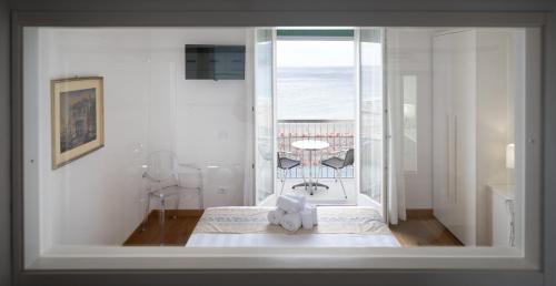 Posteľ alebo postele v izbe v ubytovaní Hotel Ligure