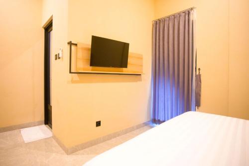 SH Hotelにあるテレビまたはエンターテインメントセンター