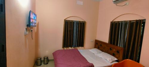 Katil atau katil-katil dalam bilik di Nirmalyam Homestay