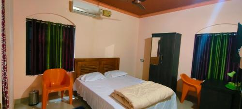 Katil atau katil-katil dalam bilik di Nirmalyam Homestay