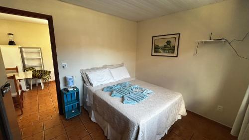 Postel nebo postele na pokoji v ubytování Kitnet 1 na Joaquina com piscina