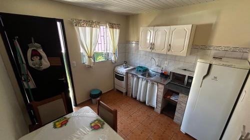 Kuchyň nebo kuchyňský kout v ubytování Kitnet 2 - Caminhos da Joaquina