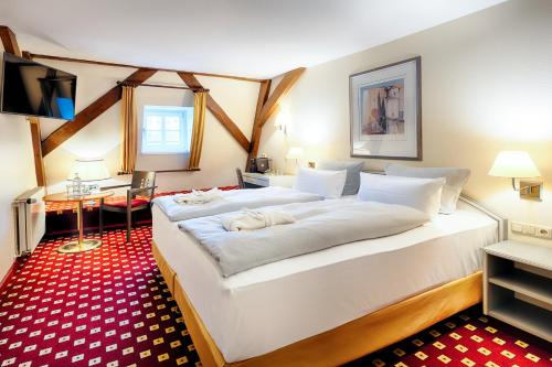 Postel nebo postele na pokoji v ubytování Welcome Hotel Bad Arolsen