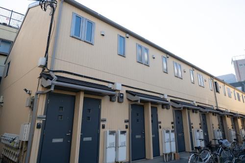 a row of doors on the side of a building at Belle Lead 105 in Tokyo