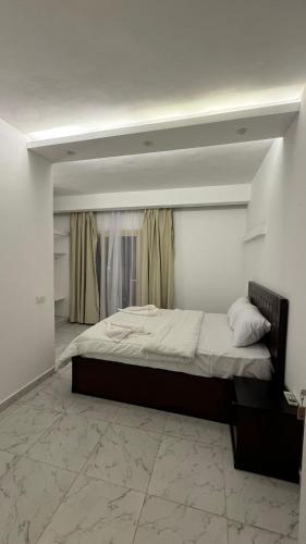 a bedroom with a large bed with a window at Desert Hotel Dahab in Dahab
