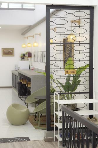 a room with a table and chairs and a window at Suites Only KKB in Kuala Kubu Baharu