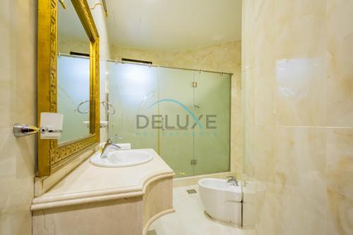 a bathroom with a sink and a mirror at Country-side Farm Villa Best for Group Gatherings by Deluxe Holiday Homes in Fujairah