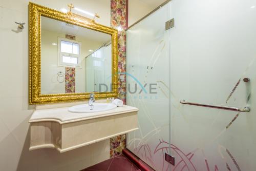 a bathroom with a sink and a mirror at Country-side Farm Villa Best for Group Gatherings by Deluxe Holiday Homes in Fujairah