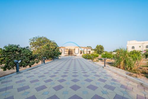 an empty road in front of a building at Country-side Farm Villa Best for Group Gatherings by Deluxe Holiday Homes in Fujairah