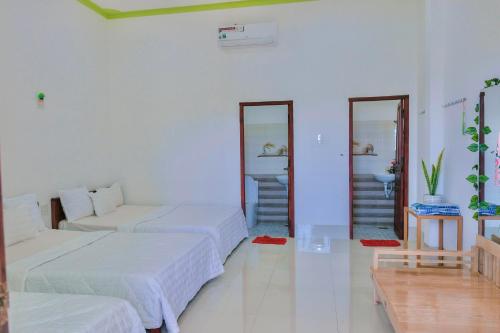 Postel nebo postele na pokoji v ubytování Homestay Châu Triều - Phan Thiết