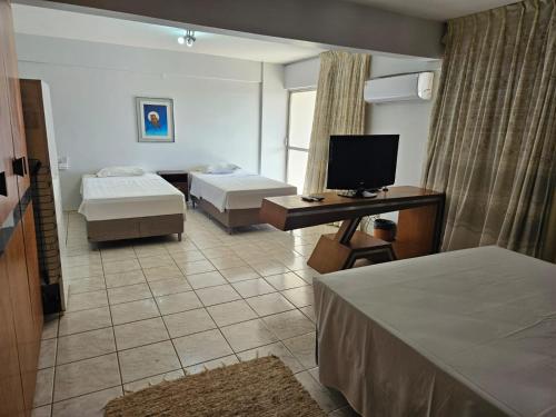 Cama ou camas em um quarto em Flat Garvey Apart-hotel