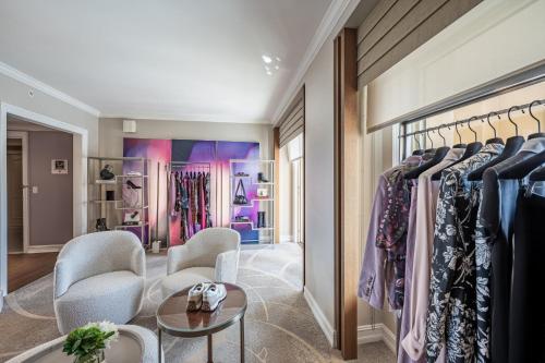 a dressing room with a rack of clothes at The Ritz-Carlton, Sarasota in Sarasota