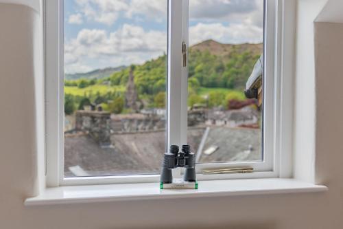 a window with a view of a city at Dwarf Hall - central Ambleside in Ambleside