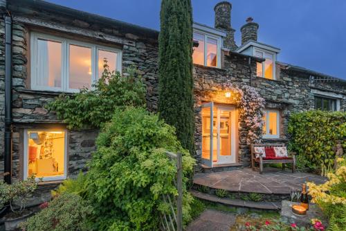 a stone house with a stone pathway leading to the front door at Dwarf Hall - central Ambleside in Ambleside