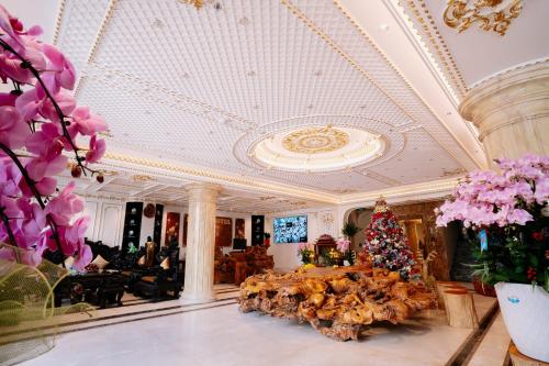 a christmas tree in the lobby of a hotel at Bao An Hotel Hung Yen in HÆ°ng YÃªn