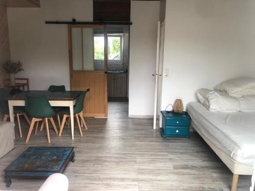 a living room with a bed and a table at Lau Anaiak in Bidart