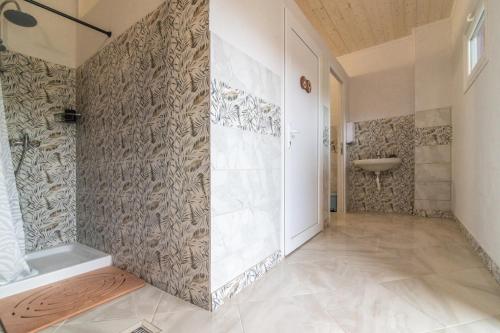 a bathroom with a shower and a sink at Agricampeggio Equinox in Carpignano Sesia
