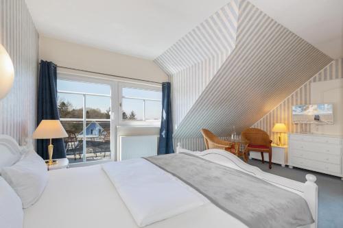 Postel nebo postele na pokoji v ubytování Hotel Klaus Störtebeker