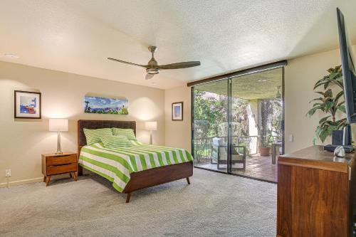 a bedroom with a bed and a sliding glass door at Condo with Community Pools and Patios in Palm Springs! in Palm Springs