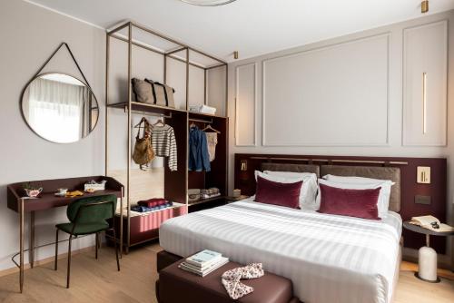 Postel nebo postele na pokoji v ubytování Adoro Hotel