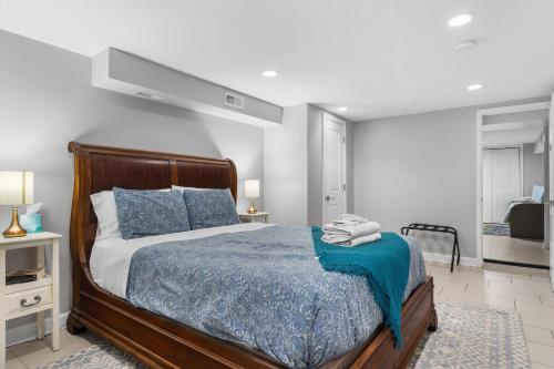 a bedroom with a bed with a blue blanket at Walk to Parks Restaurants Monuments & More in Washington, D.C.