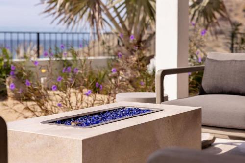 a remote control sitting on top of a table at Boutique Ocean Escape with Relaxing Amenities in El Pescadero